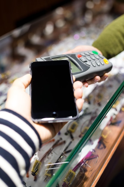 Photo mobile payment on optical glasses store