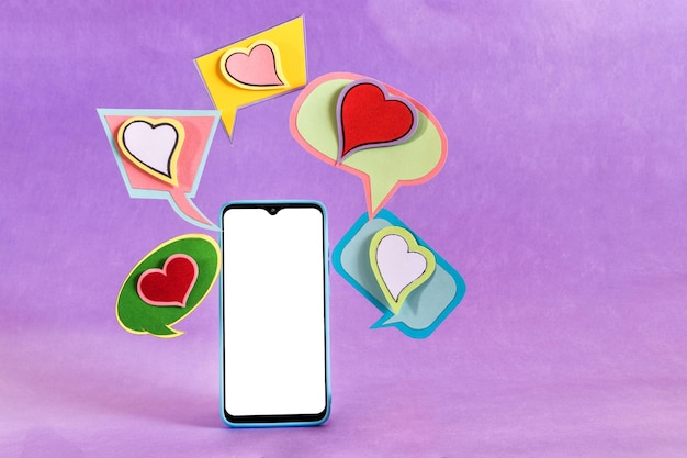 Mobile phone and dialogue bubbles with hearts Dating app concept