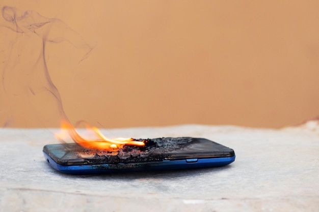 Mobile phone in fire and smoke burned mobile phone