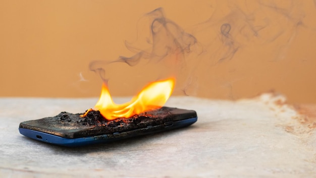 Mobile phone in fire and smoke burned mobile phone