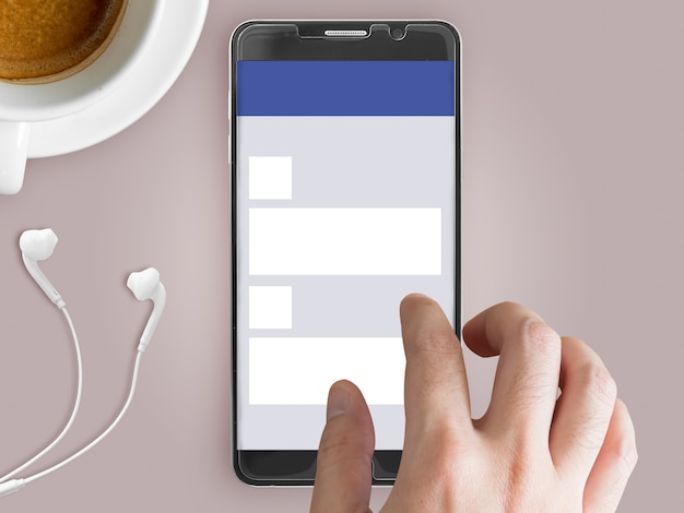 Mobile phone mockup with social network theme on screen and touching finger.