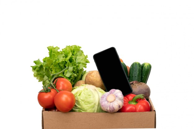 Mobile phone near vegetable box