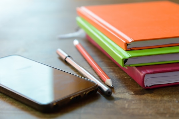 Photo mobile phone and office tools on the table