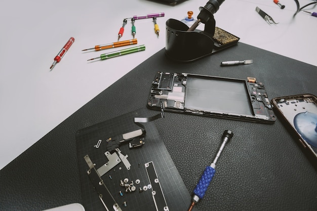 Mobile phone repair shop table with spare parts