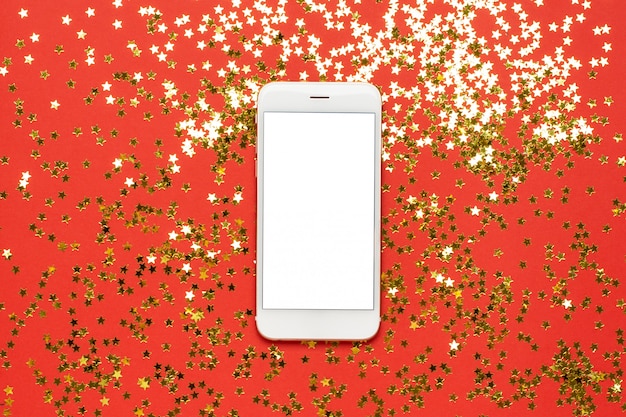 Mobile phone with golden stars confetti