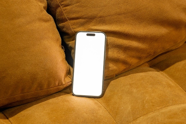 mobile phone with password page on working desk and leather sofa