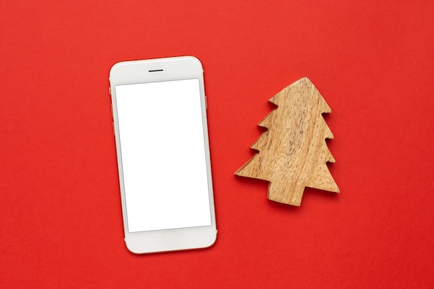 Mobile phone with wooden Christmas tree