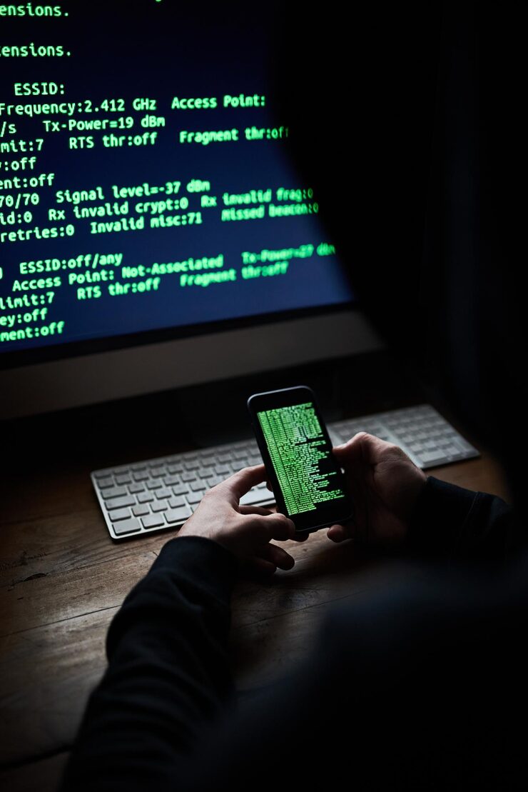 Photo mobile programmer hands and code screen with software for hacking crime or cyber security download or virus hacker programming and thief with digital database for online glitch with web banking