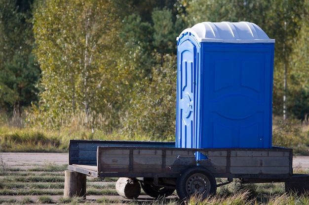 Mobile toilet Temporary cabin toilet on a trailer in the woods