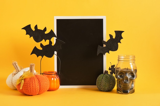 Mocap black sign and halloween decor on a bright yellow background