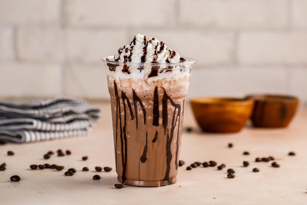 Mocha creamy Delight with ice cream and chocolate chip and coffee beans served in glass isolated on table top cafe dessert Frappuccino Blended drink