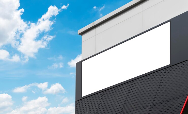 Photo mock up billboard on building with blue sky background