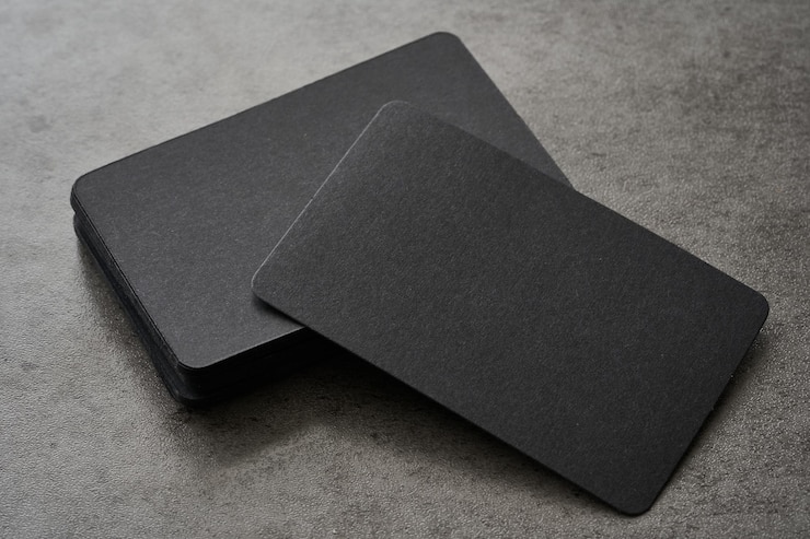 Photo mock-up or blank business card on black concrete background