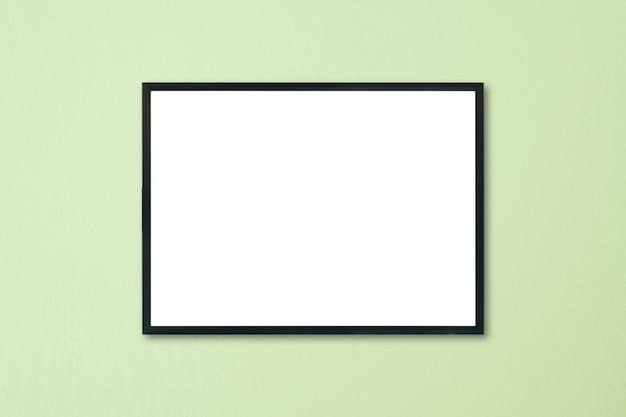 Mock up blank frame hanging on wall in room