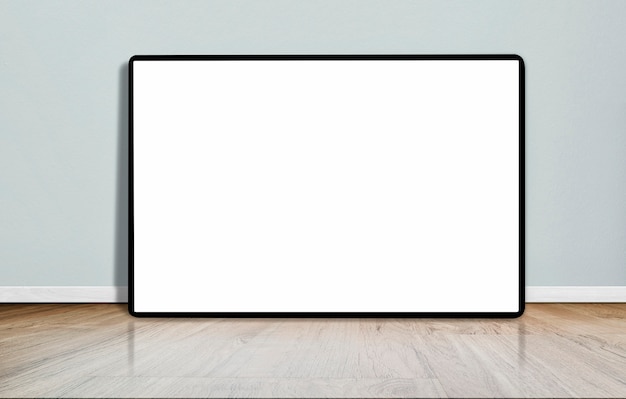 Photo mock up blank picture frame on wooden floor in empty room with concrete wall.