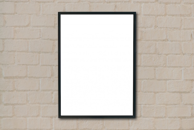 Mock up blank poster picture frame on brick wall.