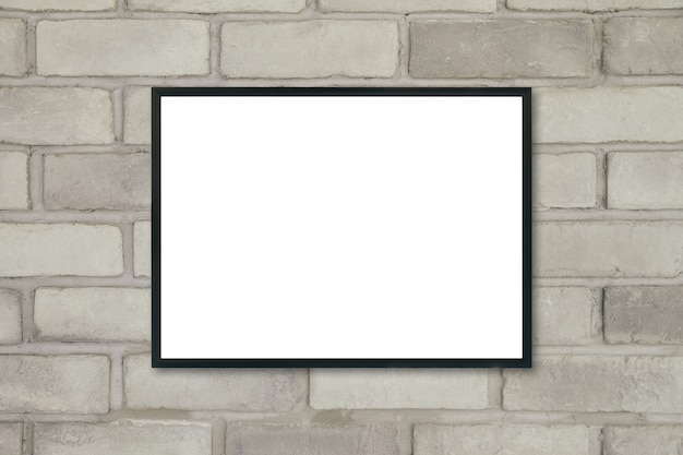 Mock up blank poster picture frame on brick wall.