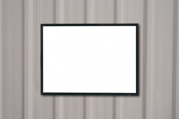 mock up blank poster picture frame on wood wall.