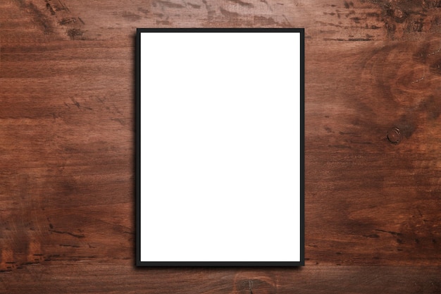 Mock up blank poster picture frame on wood wall