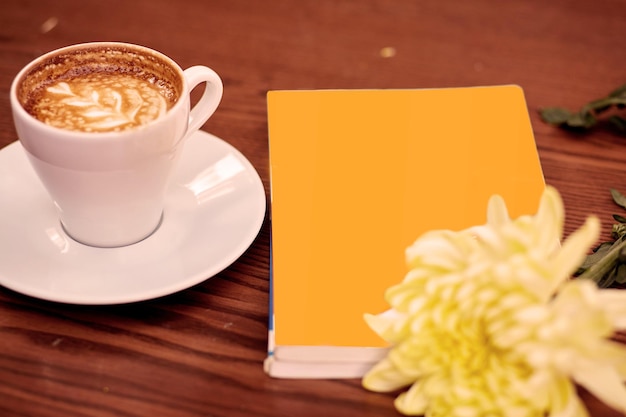 Mock up book coffee and flower Autumn morning coziness concept High quality photo