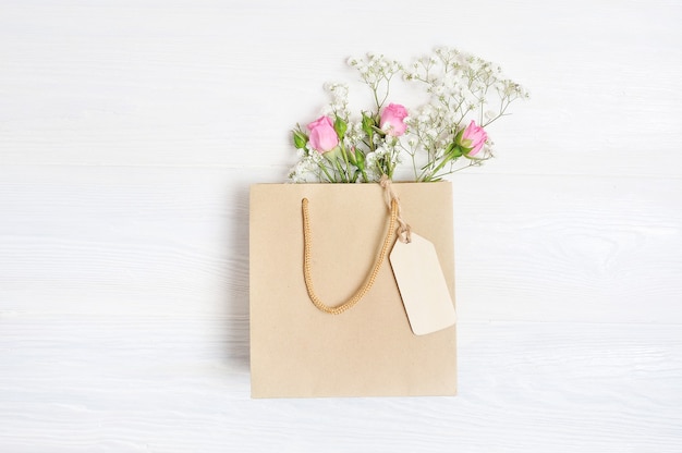 Mock up Composition paper bag and tag of white flowers rustic style, for St. Valentine's Day with a place for your text