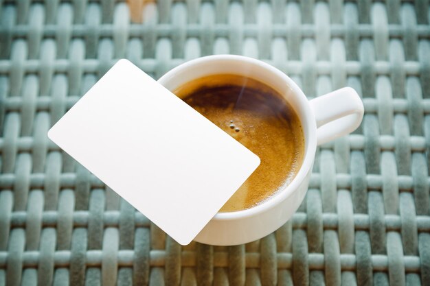 Photo mock up of credit card put near coffee cup