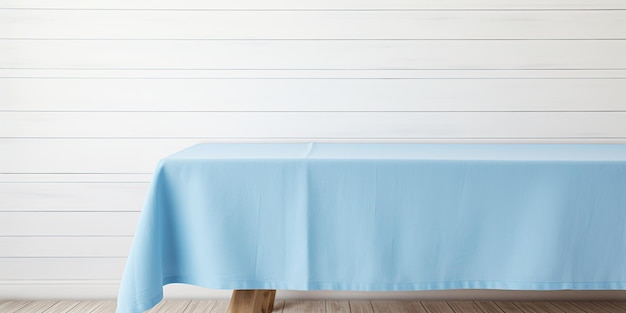 Foto modello di disegno con una tovaglia blu su un tavolo di legno bianco con spazio per le copie