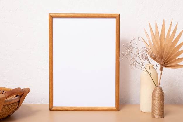 Mock up empty wooden frame mockup dried leaf and grass in vases on white background interior home de