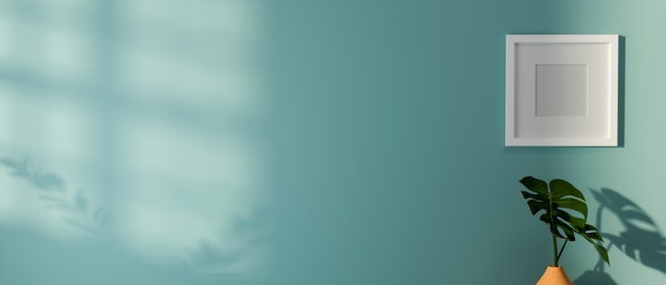 Photo mock-up frame on light blue wall and plant pot