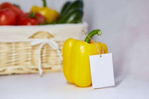 Mock up label on bell pepper Sticker product for text or price Basket of vegetables on background Organic farm products from local market