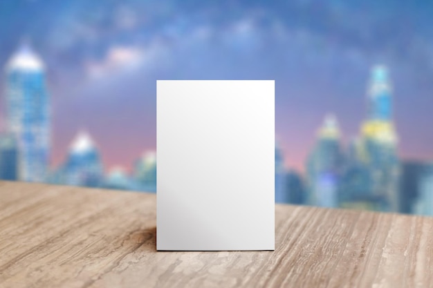 Mock up Label the blank menu frame in Bar restaurant Stand for booklet with white sheet paper acrylic tent card on table wiht blurred background can inserting the text or picture