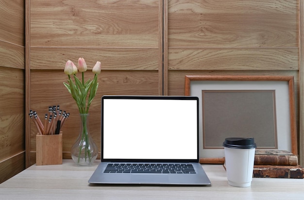 Mock up laptop computer with empty display on white desk