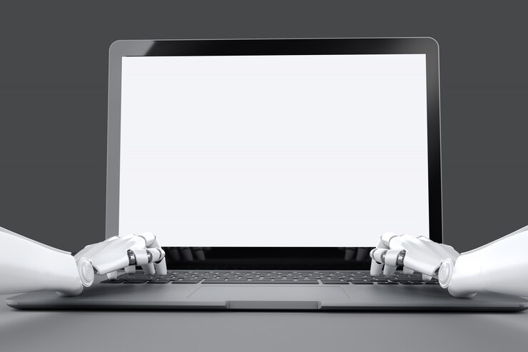 白い背景とノートパソコンのキーボードで入力するロボットの手でノートパソコンのモックアップを作成します。