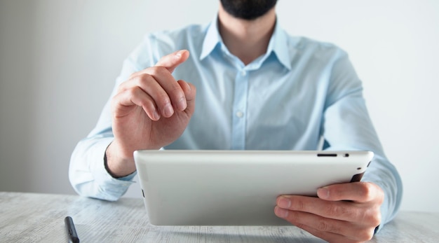 Mock up of a man holding digital tablet