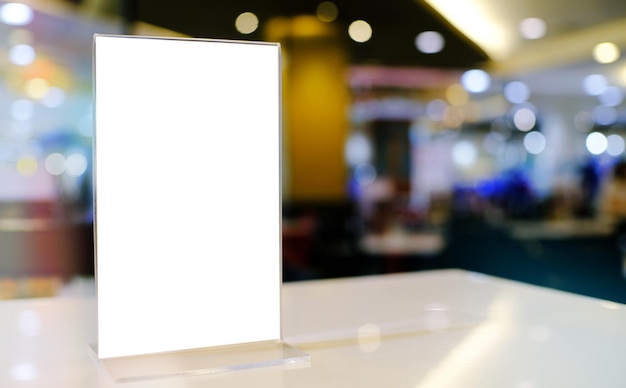 Mock up Menu frame standing on wood table in Bar restaurant cafe space for text