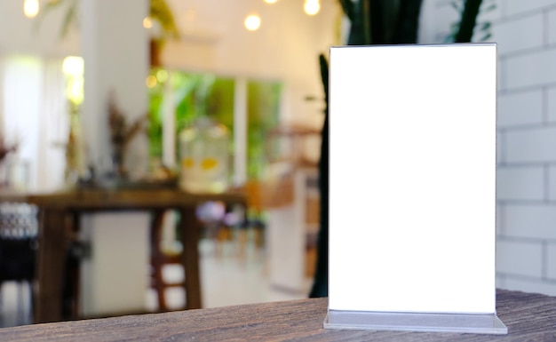 Mock up Menu frame standing on wood table in Bar restaurant cafe space for text