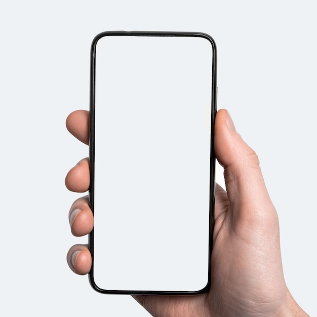 Mock-up, mockup. Man hand met de zwarte smartphone met frame minder leeg scherm