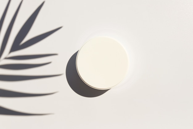 Mock up of moisturizing cream in jar and palm leaf shadow minimalism beauty skincare and spa