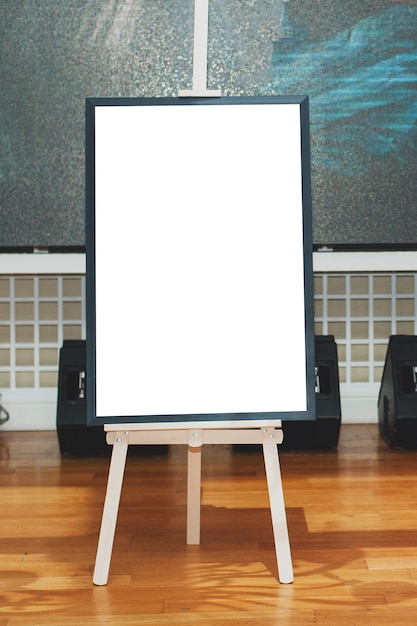 Photo mock up - painting on an easel at an exhibition or auction.