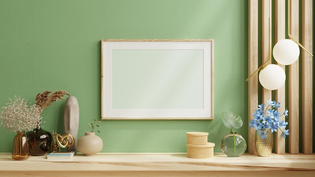 Mock up photo frame green wall mounted on the wooden shelf