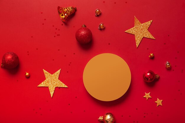 Mock up podium or pedestal for skincare beauty products and Christmas decorations top view on red background