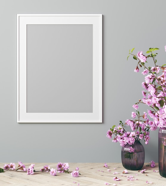 Mock up posterframe in modern interieur met roze bloemen en grijze achtergrond, woonkamer