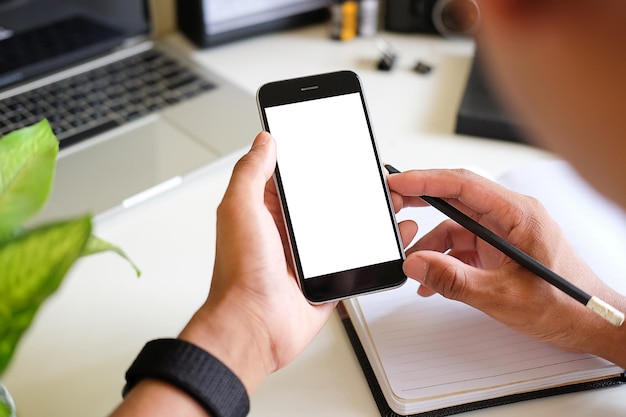 Mock up smartphone of hand holding black mobile phone with blank white screenx9