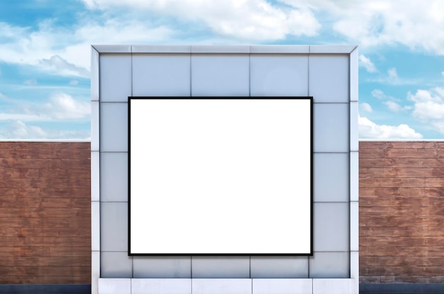 Mock up white background billboard and clipping path on building with blue sky background