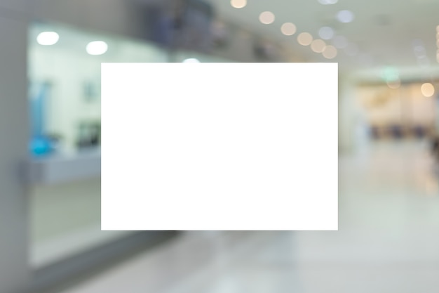 Белая бумага макета A4 или белый рекламный плакат, отображаемый на передней части яркого офисного интерьера, - stock photo
