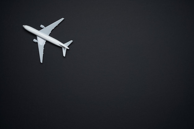 Mockup airplane isolated on black background , travel concept .