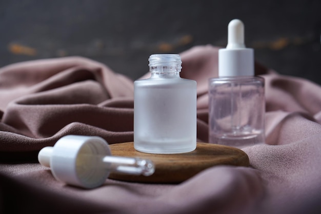 Mockup of beauty cosmetic makeup bottle serum dropper product with skincare healthcare concept.