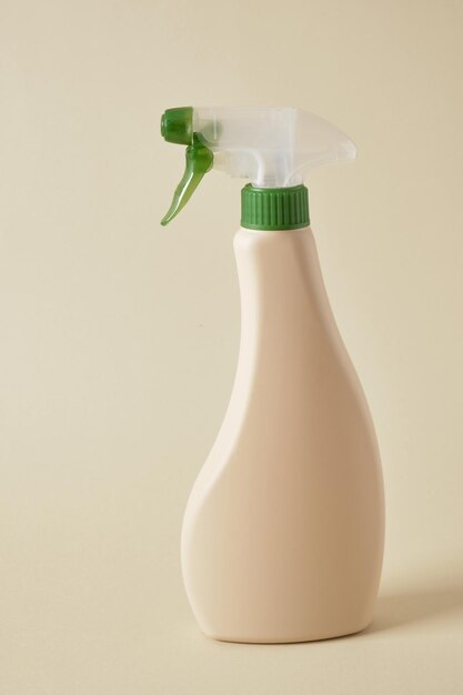 Mockup beige spray bottle with ecocleaner e on a beige background nontoxic products for eco cleaning concept