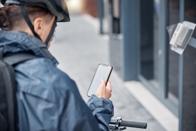 Mockup bike or man with phone for delivery in city street or road for GPS location or networking outdoor App travel or male search with smartphone or communication social media or 5g network