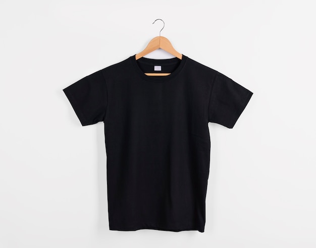 Photo mockup blank black t-shirt for advertising isolated on white background.